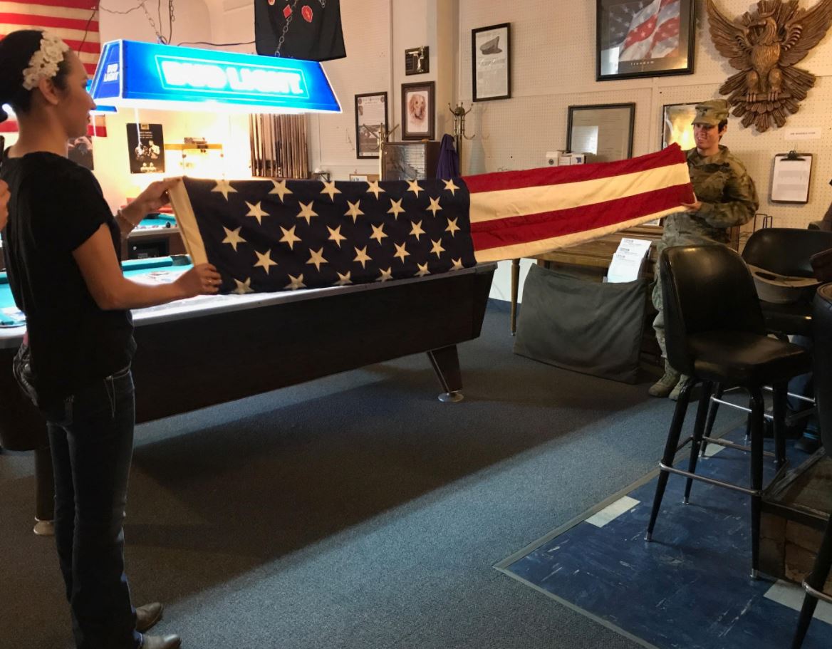VFW Post 1934 members perform a flag folding ceremony in honor of Jon Guncay’s deceased platoon leader, 1st Lt. Ashley Henderson-Huff.